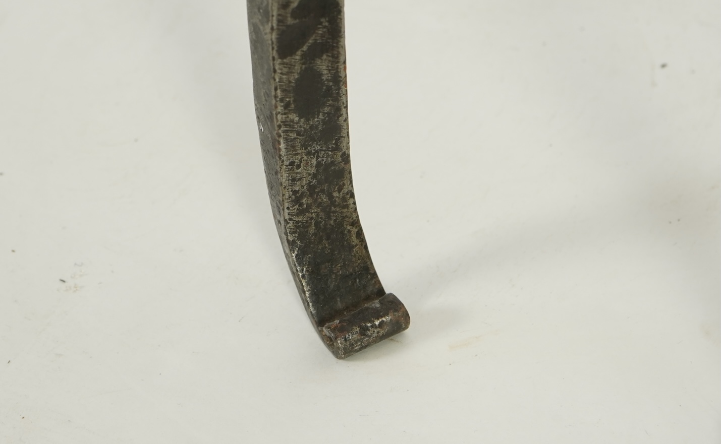A pair of standing iron pricket candlesticks